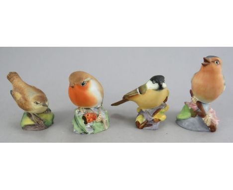 A group of twentieth century Royal Worcester birds. To include: Chaffinch, Great Tit, Robin and Wren. 6 - 8 cm tall. (4)Condi