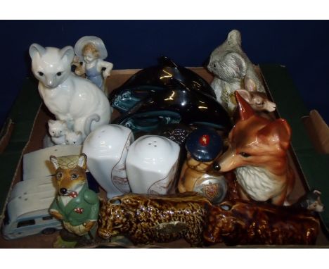 Selection of various animal ornaments including Poole dolphins, two Rutherfords Scotch Whisky cattle, Filey salt and pepper e