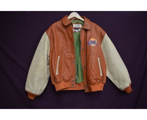 A vintage collectable Planet Hollywood bomber style leather jacket in brown and tan colour way, larger size.