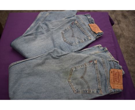 Two pairs of vintage Levi 501 jeans.