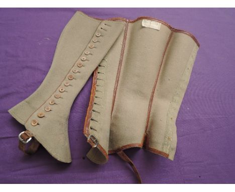 A pair of Edwardian grey wool ladies button up gaiters, paper labels present to insides.