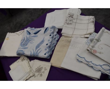 A selection of vintage and antique embroidered table linen, To include table cloths and napkins.