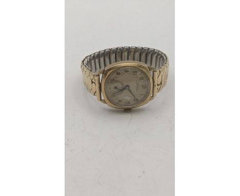 A gent's 9ct yellow gold cased manual wind wristwatch (gold back 4.2g) on a gold plated expanding bracelet Location:If there 