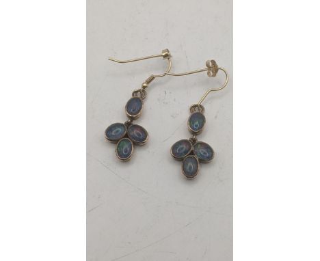 Opal earrings - a pair of 4 oval cut opal droplets set in yellow gold tested as 9ct gold, total weight 6.2g Location:If there
