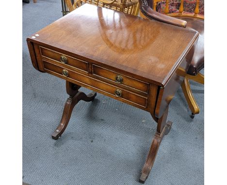 A reproduction mahogany sofa table having two fall flaps and three drawers, 70.5h x 67wLocation: If there is no condition rep