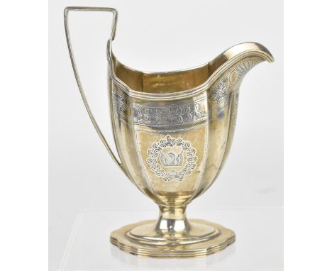 A George III silver cream jug on stand, London between 1797 and 1810, date letter partially rubbed, designed with lobbed body