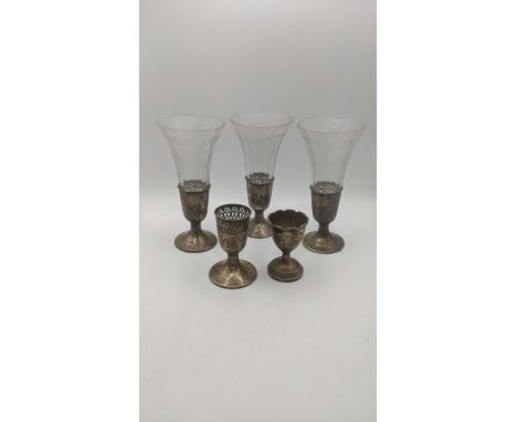 Three sterling silver cut glass vases, along with one extra base, along with a silver eggcup, total weight 137.8g Location: I