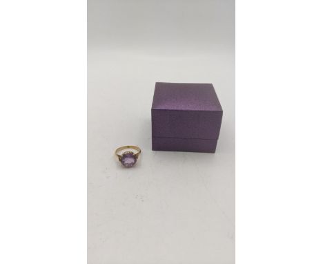 A gold ring stamped 18k set with an amethyst coloured stone, size N, 4.7gLocation:If there is no condition report shown, plea
