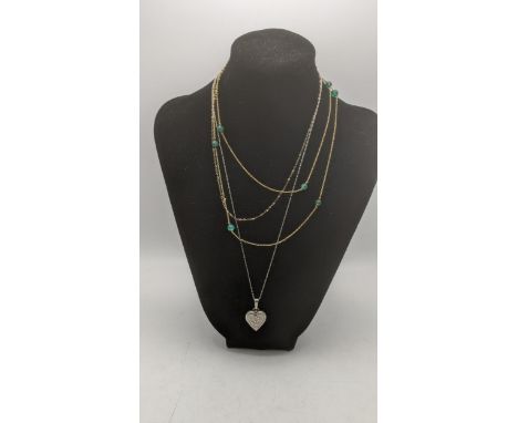 Three ladies necklaces to include a 9ct gold fine link example, a 9ct gold necklace laced with jade coloured beads A/F, total