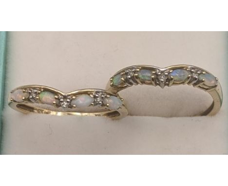 Opal and diamonds 9ct yellow gold rings to include a pair set with four oval shaped opals, in four claw setting and three sma