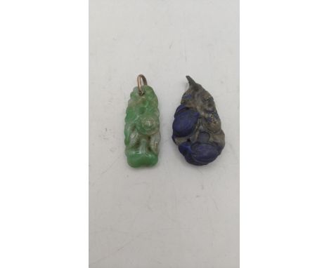 A jade albite floral carved pendant, along with a carved lapis lazuli pendant Location:If there is no condition report shown,