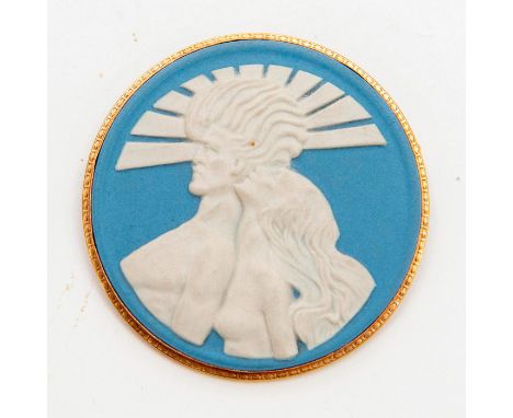 Light blue round medallion with white relief of a woman and man in a gold tone pin.Wedgwood and Made in England Impressed to 