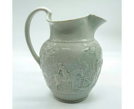 Earthenware pitcher with embossed scene of group of fix hunters ready to start the chase. Wedgwood impressed to base.Issued: 
