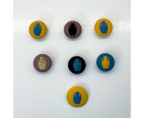 Six studs, without holes, in various colours. One yellow/blue button.Wedgwood England backstamp. Largest, yellow/blue button,