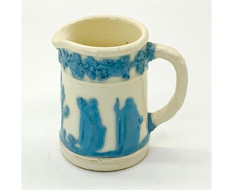 Lovely pitcher with classical figures and grapevine garland in light blue on cream. Hallmark, Wedgewood Embossed Queensware M