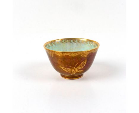 Deep ruby lustreÂ&nbsp;ground decorated with gilt butterflies and border to exterior. Mother of pearl ground to interior deco