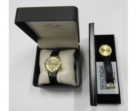 Two original cased Rotary gents wristwatches with guarantees etc. Both with leather straps. 