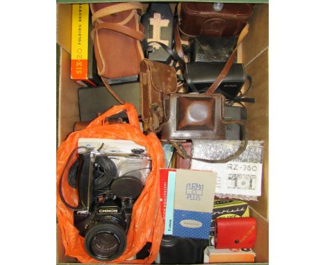 A box of assorted cameras, filters, light meter etc.