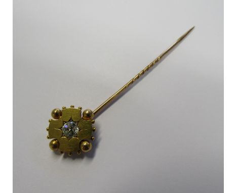 A 15ct gold star set old European cut diamond stick pin with the diamond diameter measuring approx. 4mm in a circular surroun