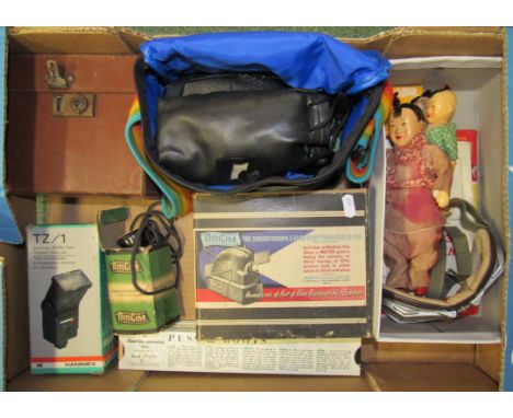 A Mini Cine cinemograph and film strips together with camera, volt meter etc.