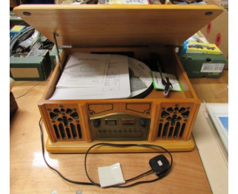 A Prolectrix cassette, radio, CD player in a light coloured wooden cabinet, not tested.