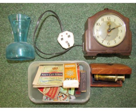 A small brass pocket telescope in wooden box together with a bakelite clock etc.