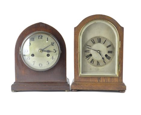 Two wood cased mantle clocks with brass clock faces, largest H30cm W20cm D12.5cmPendulums attached 