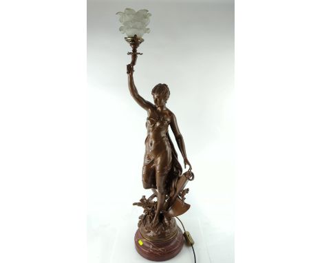 CH Levy signed, bronzed lamp in the form of a lady standing on a plough holding a torch on a carved marble base, overall heig