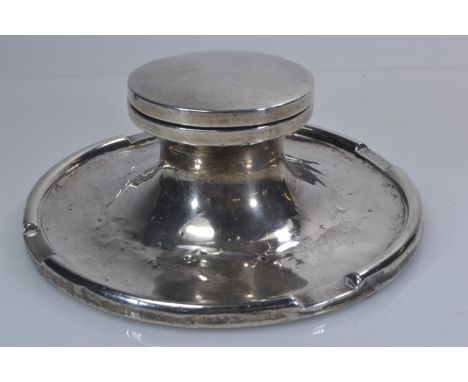 Silver capstan inkwell, maker's mark rubbed, Birmingham 1928, with well, diameter 15cmRubbing to hallmarks. Numerous dents. 