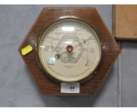 AN OAK FRAMED HEXAGONAL SHAPED WALL BAROMETER BY ROBERT LOVE &amp; SON  GREENOCK
