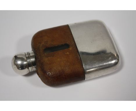 A SILVER PLATED AND GLASS HIP FLASK