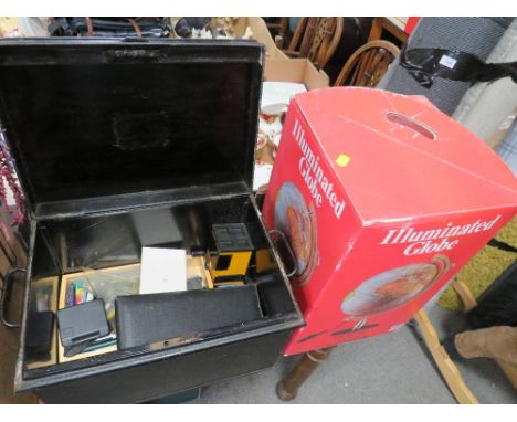 A VINTAGE TIN TRUNK CONTAINING ASSORTED STATIONARY, TOGETHER WITH A BOXED ILLUMINATED GLOBE 