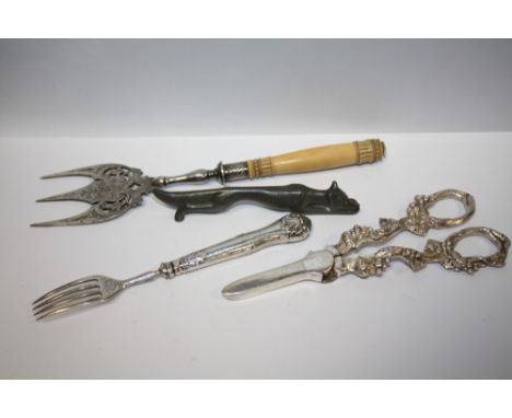 A WILLIAM IV SILVER FORK, TOGETHER WITH A FOX SHAPED KNIFE REST ETC. (4) 