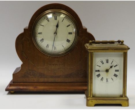 An Edwardian mahogany and marquetry mantel clock, c.1905; a brass carriage timepiece (2)