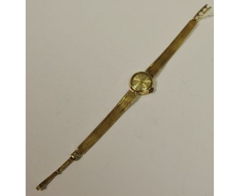A 9ct gold lady's Tissot watch, manual, integral 9ct gold bracelet, weight without movement 11.1g