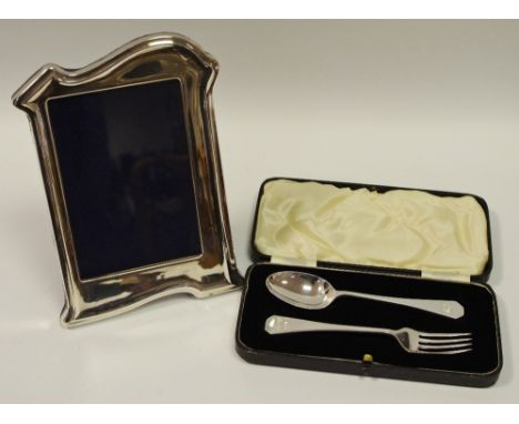 An Art Deco style silver easel photograph frame, Henry Hutton and Co, Sheffield 1991; a cased silver christening presentation