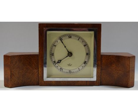 A mahogany cased mantel clock by Elliot, silvered chapter ring, Roman numerals.