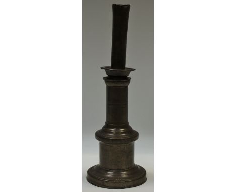 A 19th century pewter whale oil peg lamp.