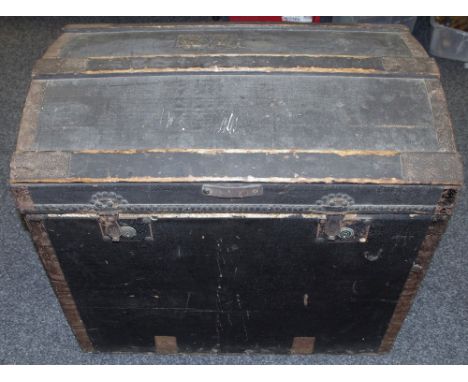 A canvas and wood bound dome top trunk Minshall Bengough label to interior