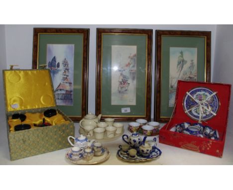 Oriental - a cased miniature black tea service from Singapore; others; a set of three framed watercolours of village life by 