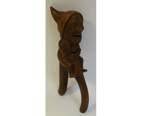 A Black Forest novelty nutcracker in the form of a hooded man.