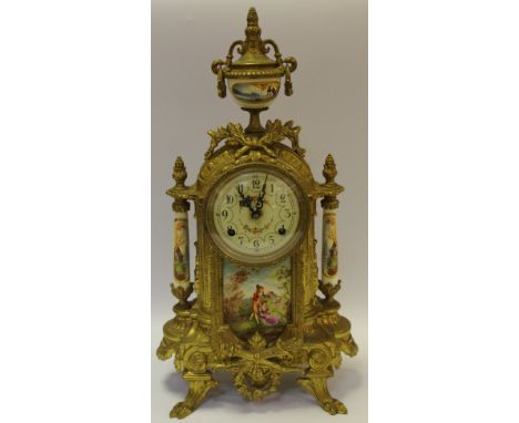 A French style mantel clock with movement by Franz Hermle, Germany, striking on a bells with 8 day movement. The ornate gilt 