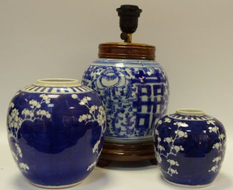 A Chinese blue and white ovoid ginger jar, fitted as a table lamp; a Chinese ginger jar, painted with blossoming prunus; anot