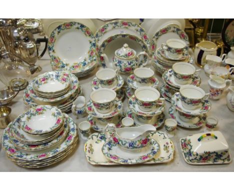 A Booth's Floradora part tea and dinner service comprising teapot, coffee pot, bowls, cups, saucers, etc
