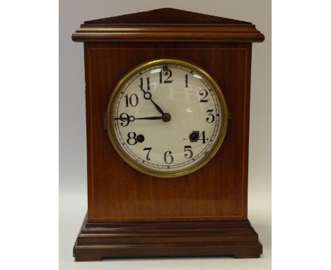 An Edwardian mahogany mantel clock New Haven USA, Architectural pediment, painted dial, Arabic numerals
