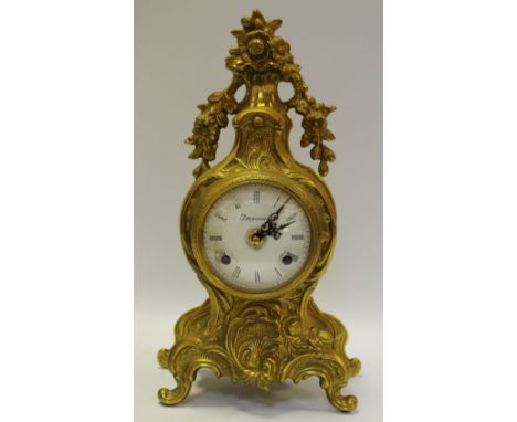 A French style mantel clock with movement by Franz Hermle, no. 130 070, Roman numerals, white dial, two winding holes, signed