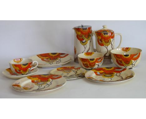 A Clarice Cliff twenty one piece part tea serviceDecorated in the Rhodanthe pattern, to include hot water jug with chrome lid