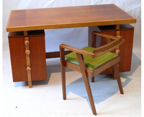 Gordon Warr (20th century) knee hold desk of rectangular form The top section with light oak trimming, having two teak remova