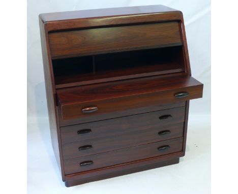 An excellent quality post war Danish rosewood bureau Modelled in typical form, the roller shutter door operated by the pull-o