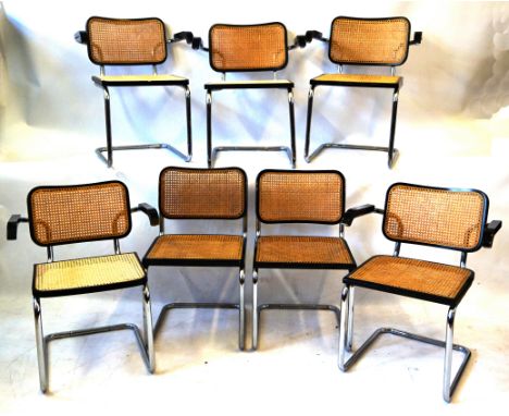 Seven Marcel Breuer chrome and black Cesca chairsComprising five carvers and two singles, each with cane backs and seats, ori